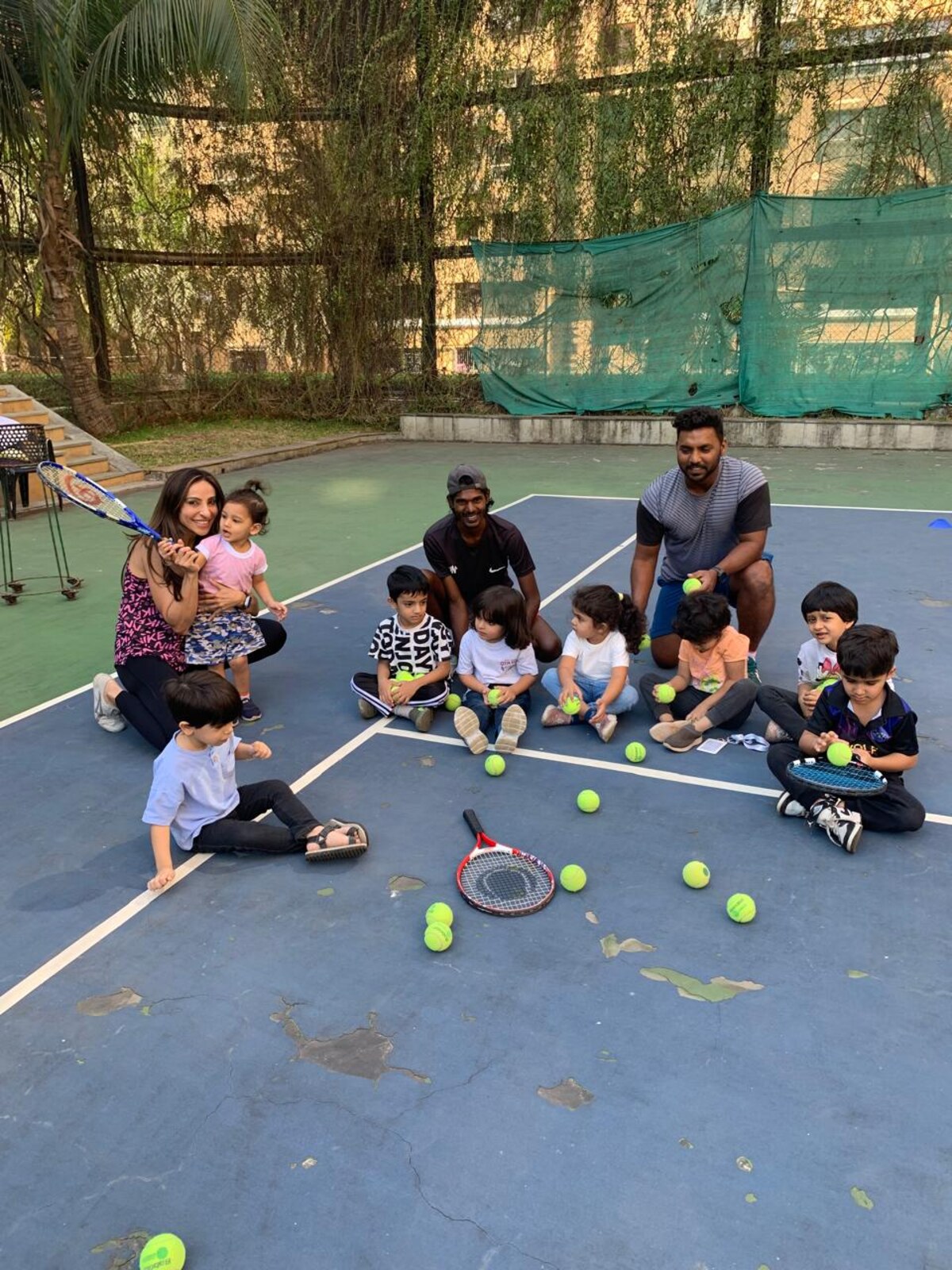 Children building coordination and teamwork through outdoor court games