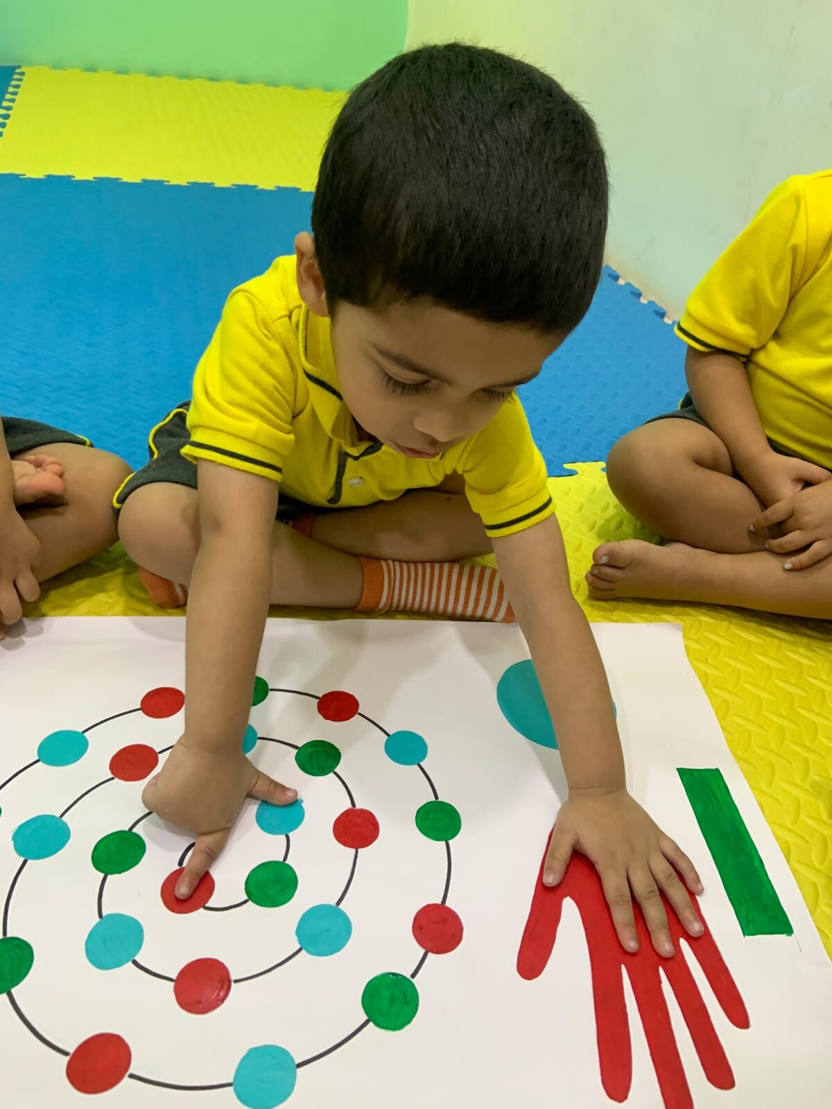 Children working together on a colour and movement classroom activity