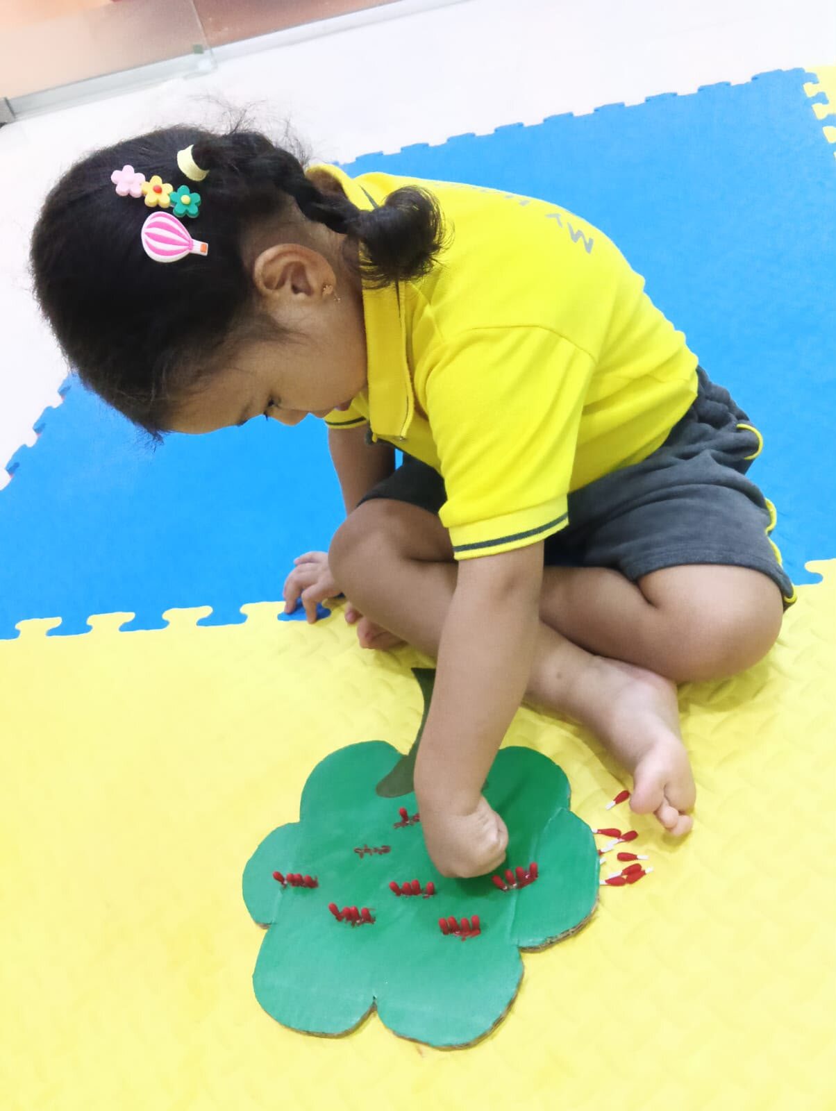 Child concentrating during a hands-on classroom activity