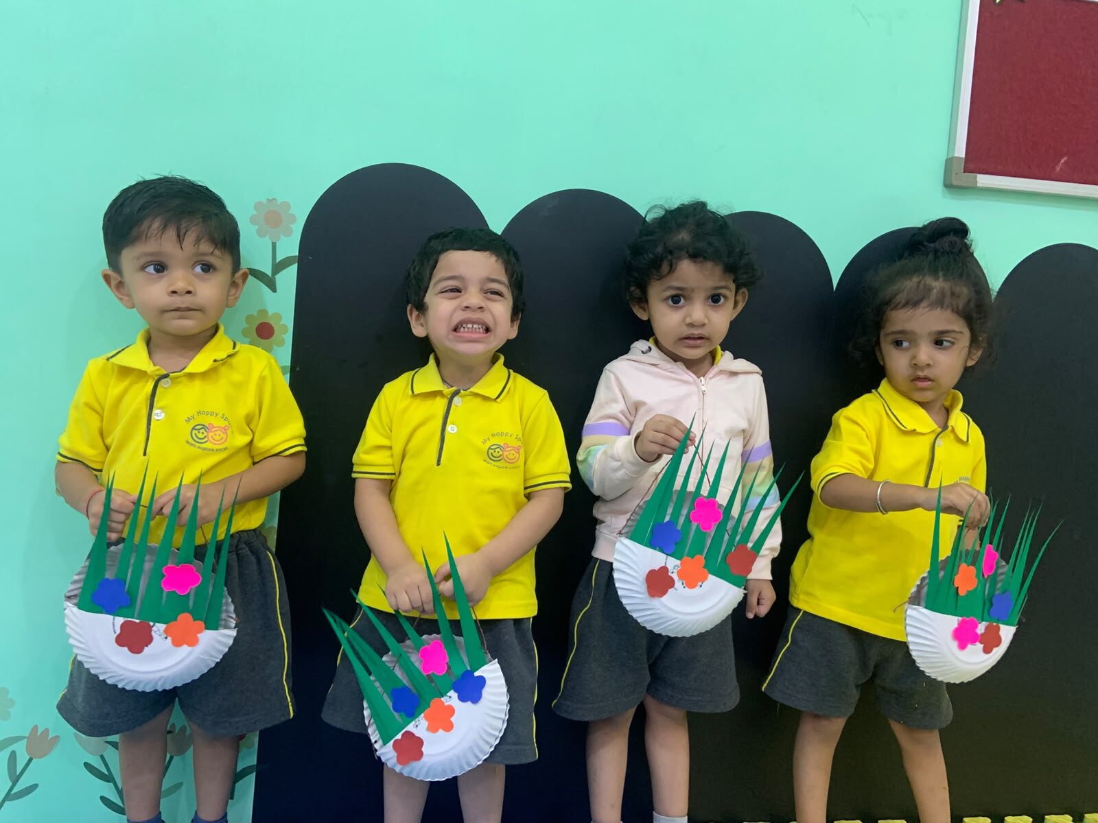 Children holding their handmade craft bags